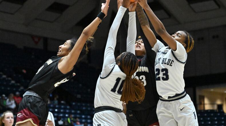 Brookwood's Diana Collins (left), Norcross' Kayla Lindsey (10) Brookwood's Jade Weathersby (23) and Norcross' Jania Akins (rihgt) fight for a rebound during 2023 GHSA Basketball Class 7A Girl’s State Championship game at the Macon Centreplex, Saturday, March 11, 2023, in Macon, GA. (Hyosub Shin / Hyosub.Shin@ajc.com)