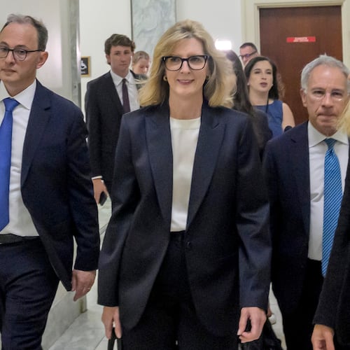 Goldman Sachs senior counsel Kathryn Ruemmler, center, arrives for a House Committee on Oversight and Government Reform hearing regarding her ties to Jeffrey Epstein, on Capitol Hill, Wednesday, July 15, 2026, in Washington. (AP Photo/Rod Lamkey, Jr.)