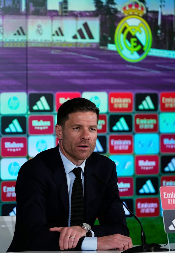 Former footballer Xavi Alonso speaks to reporters during his presentation as Real Madrid's new coach at the Club's headquarters in Madrid on Monday 26 May 2025. (AP Photo/Jose Breton)