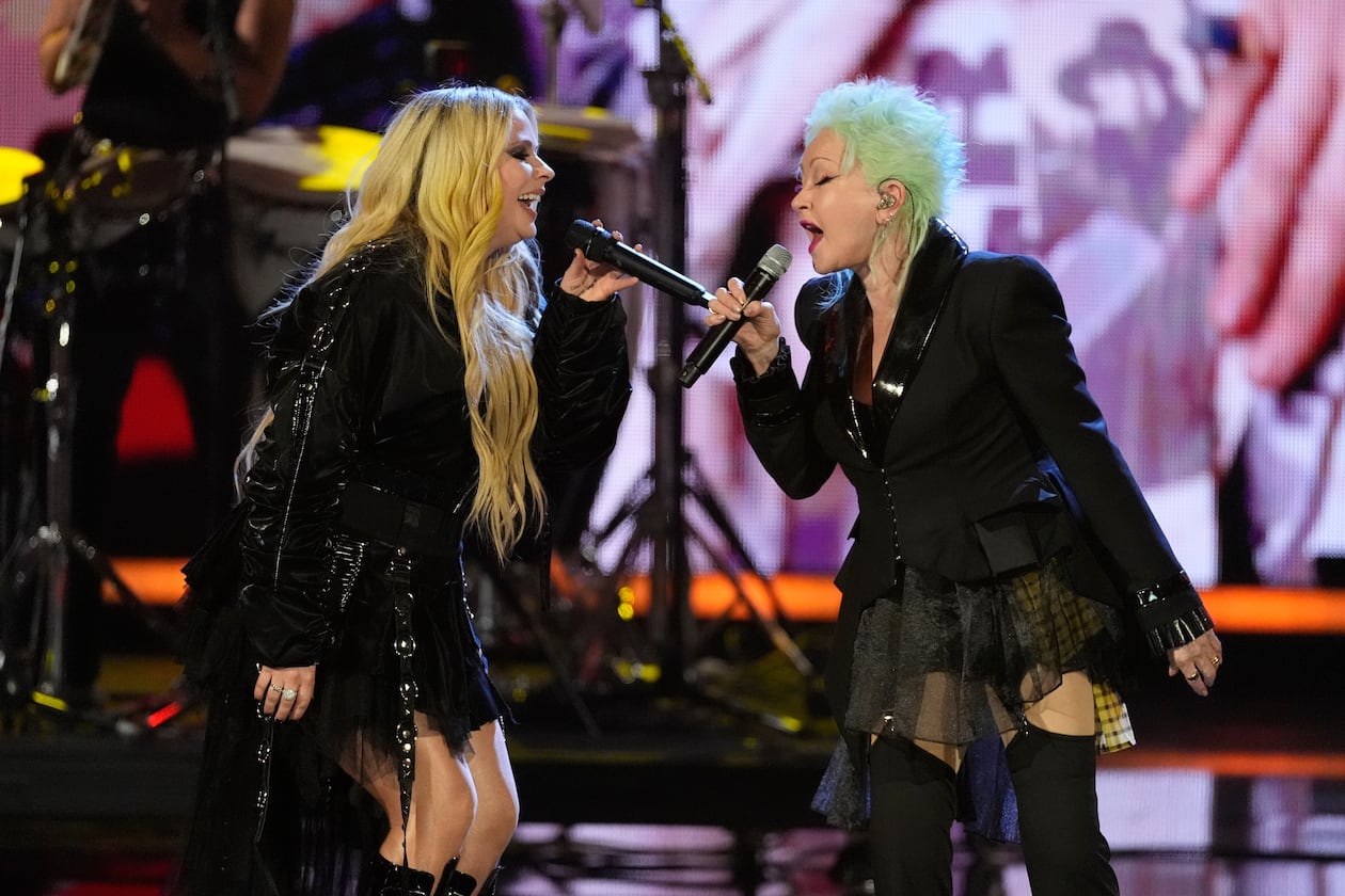 Avril Lavigne, left and Cyndi Lauper perform during the 2025 Rock and Roll Hall of Fame Induction Ceremony on Saturday, Nov. 8, 2025, at L.A. Live in Los Angeles. (AP Photo/Chris Pizzello)