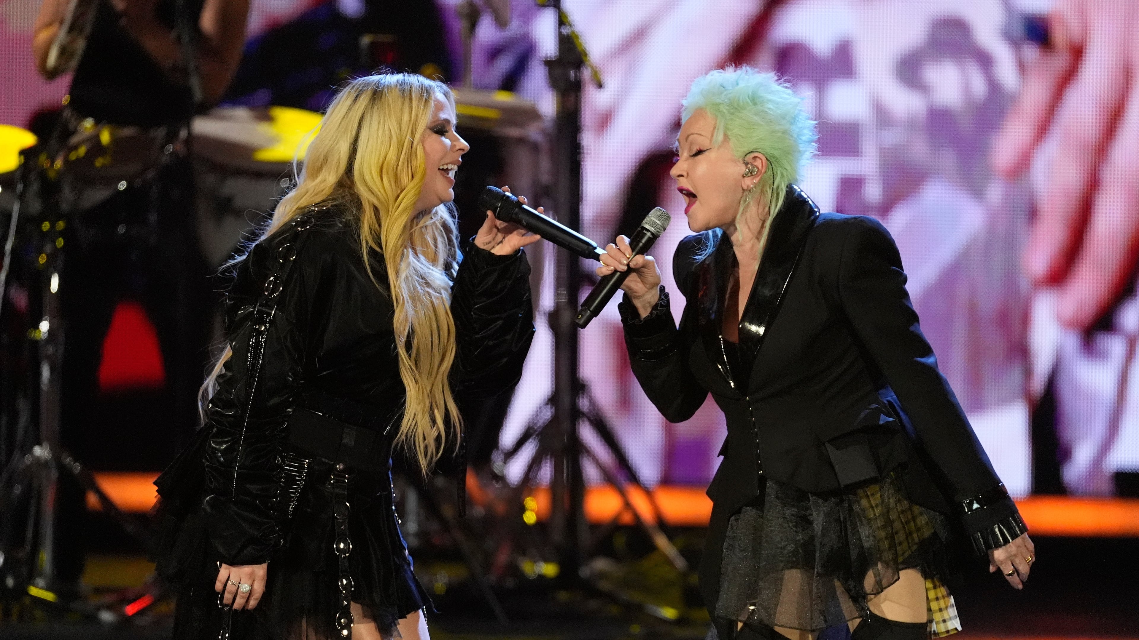Avril Lavigne, left and Cyndi Lauper perform during the 2025 Rock and Roll Hall of Fame Induction Ceremony on Saturday, Nov. 8, 2025, at L.A. Live in Los Angeles. (AP Photo/Chris Pizzello)