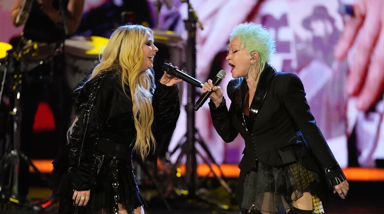 Avril Lavigne, left and Cyndi Lauper perform during the 2025 Rock and Roll Hall of Fame Induction Ceremony on Saturday, Nov. 8, 2025, at L.A. Live in Los Angeles. (AP Photo/Chris Pizzello)