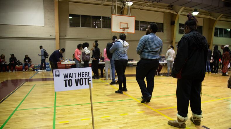 People were still voting at 9:30 p.m. Tuesday at Samuel H. Archer Hall at Morehouse College in Atlanta. STEVE SCHAEFER / SPECIAL TO THE AJC