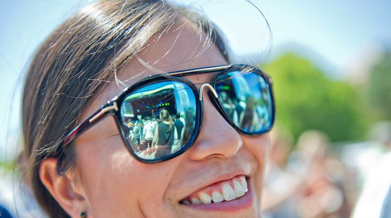 April 20, 2014 Atlanta - The main stage is reflected in Johanna Isler's sunglasses as the Dirty Dozen Brass Band performs on stage during the Sweetwater 420 Festival at Centennial Olympic Park on Sunday, April 20, 2014. The three day festival featured musical acts such as the Dirty Dozen Brass Band, G. Love & Special Sauce, Chris Robinson Brotherhood, Sublime and Galactic. Other activities included cornhole tournaments, an Easter egg hunt, food, beer and much more.   JONATHAN PHILLIPS / SPECIAL