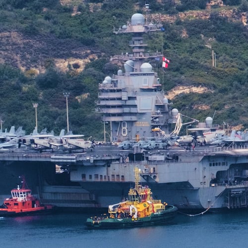 FILE - The USS Gerald R. Ford aircraft carrier is docked at Souda Naval Base near Chania on the island of Crete, Monday, March 23, 2026. (AP Photo/Giannis Angelakis).