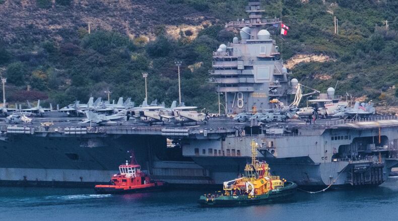 FILE - The USS Gerald R. Ford aircraft carrier is docked at Souda Naval Base near Chania on the island of Crete, Monday, March 23, 2026. (AP Photo/Giannis Angelakis).