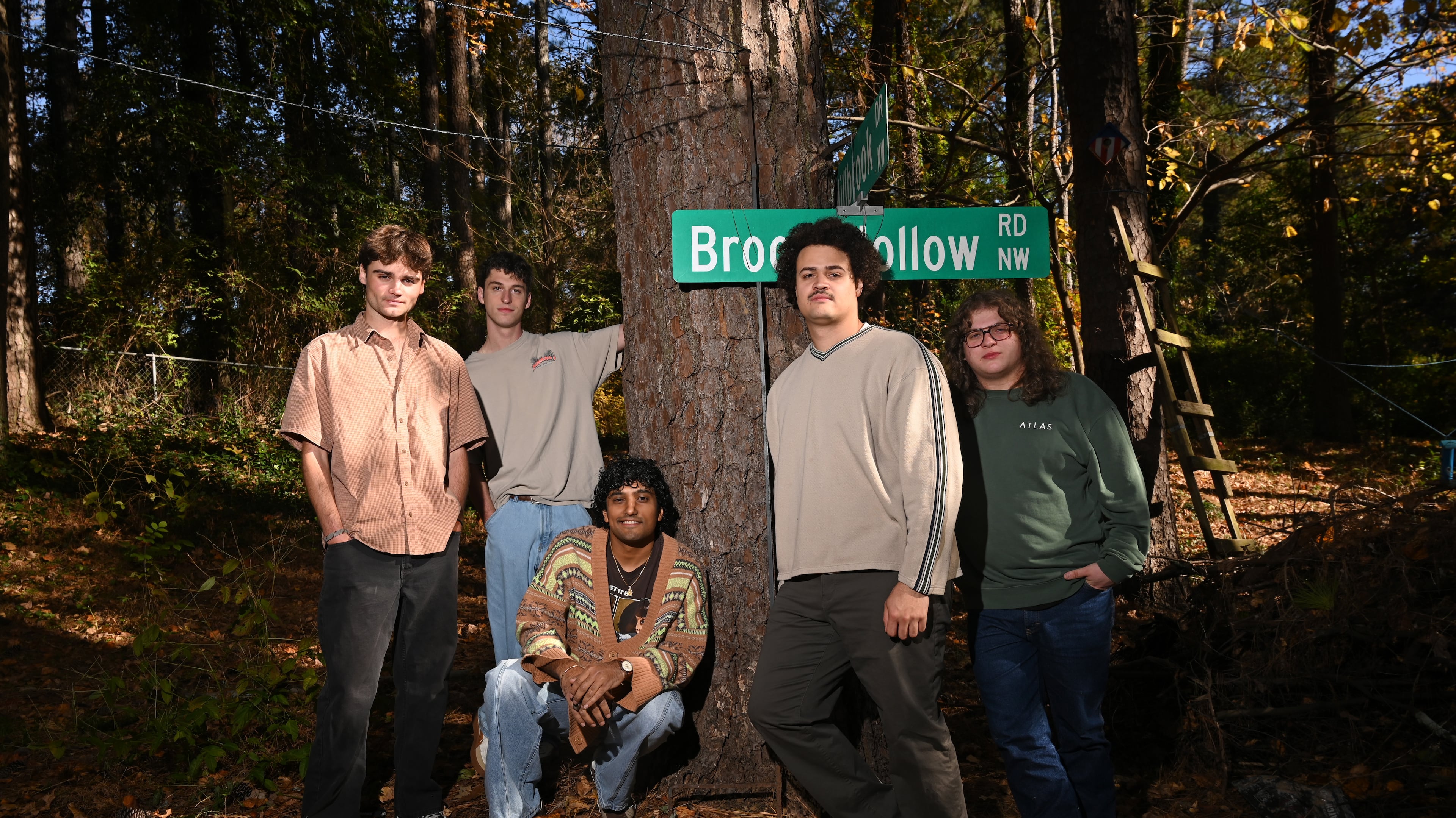 Penelope Road members James Kopp (from left), Charles Eastman, Koan Roy-Meighoo, Anthony Smith and Max Moore hang at Eastman’s home on Thursday, Nov. 13, 2025, in Brookhaven. They’ll perform three headlining shows at venues across Atlanta this month. (Hyosub Shin/AJC)