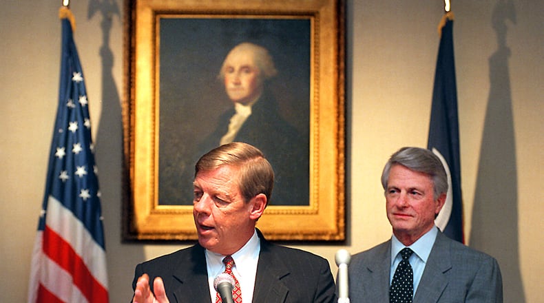 961211. ATLANTA, GA. Johnny Isakson answers questions at the Governor's Mansion Wednesday, 12/11/96, about his appointment to the chair of the State Board of Education. Gov. Zell Miller, in the background, made the announcement of Isakson and other new board members. RICH ADDICKS/STAFF.