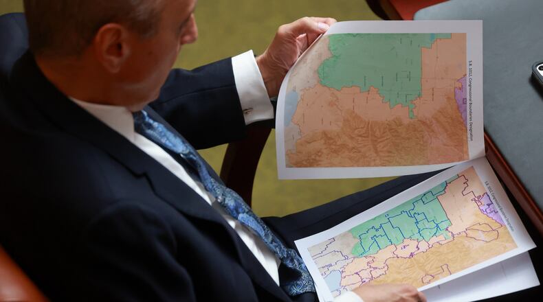 FILE -Rep. Cory Maloy, R-Lehi, holds a packet of potential redistricting maps as SB1012 Congressional Boundaries Designation is discussed in the House chamber during a special session at the Capitol on Monday, Oct. 6, 2025, in Salt Lake City. (Kristin Murphy/The Deseret News via AP, File)