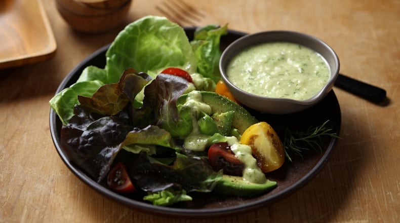 Homemade dill vinaigrette is a refreshing choice on a tomato and cucumber salad. (E. Jason Wambsgans/Chicago Tribune/TNS)