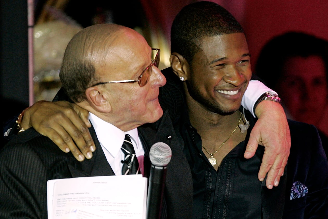 Clive Davis, left, and Usher appear at Davis' 2005 pre-Grammy party in Beverly Hills, Calif., on Feb. 12, 2005. (Chris Polk/AP)