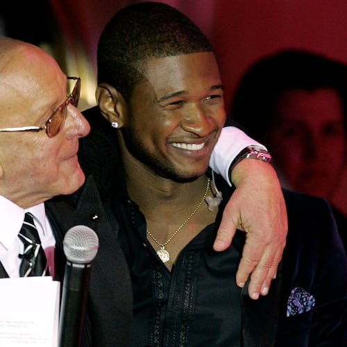 Clive Davis, left, and Usher appear at Davis' 2005 pre-Grammy party in Beverly Hills, Calif., on Feb. 12, 2005. (Chris Polk/AP)