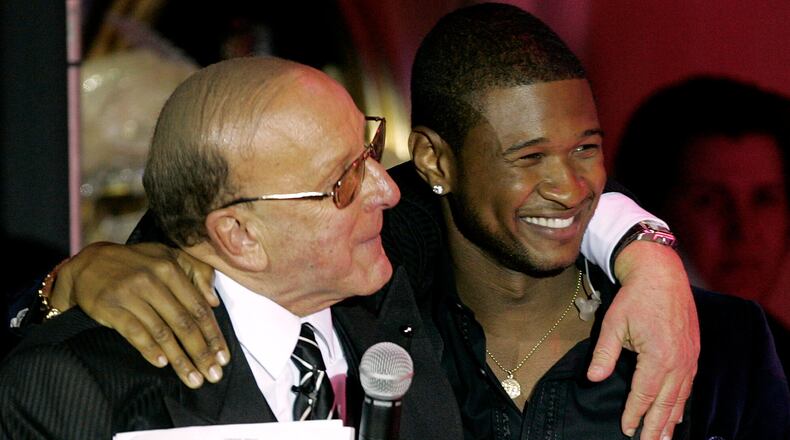 Clive Davis, left, and Usher appear at Davis' 2005 pre-Grammy party in Beverly Hills, Calif., on Feb. 12, 2005. (Chris Polk/AP)