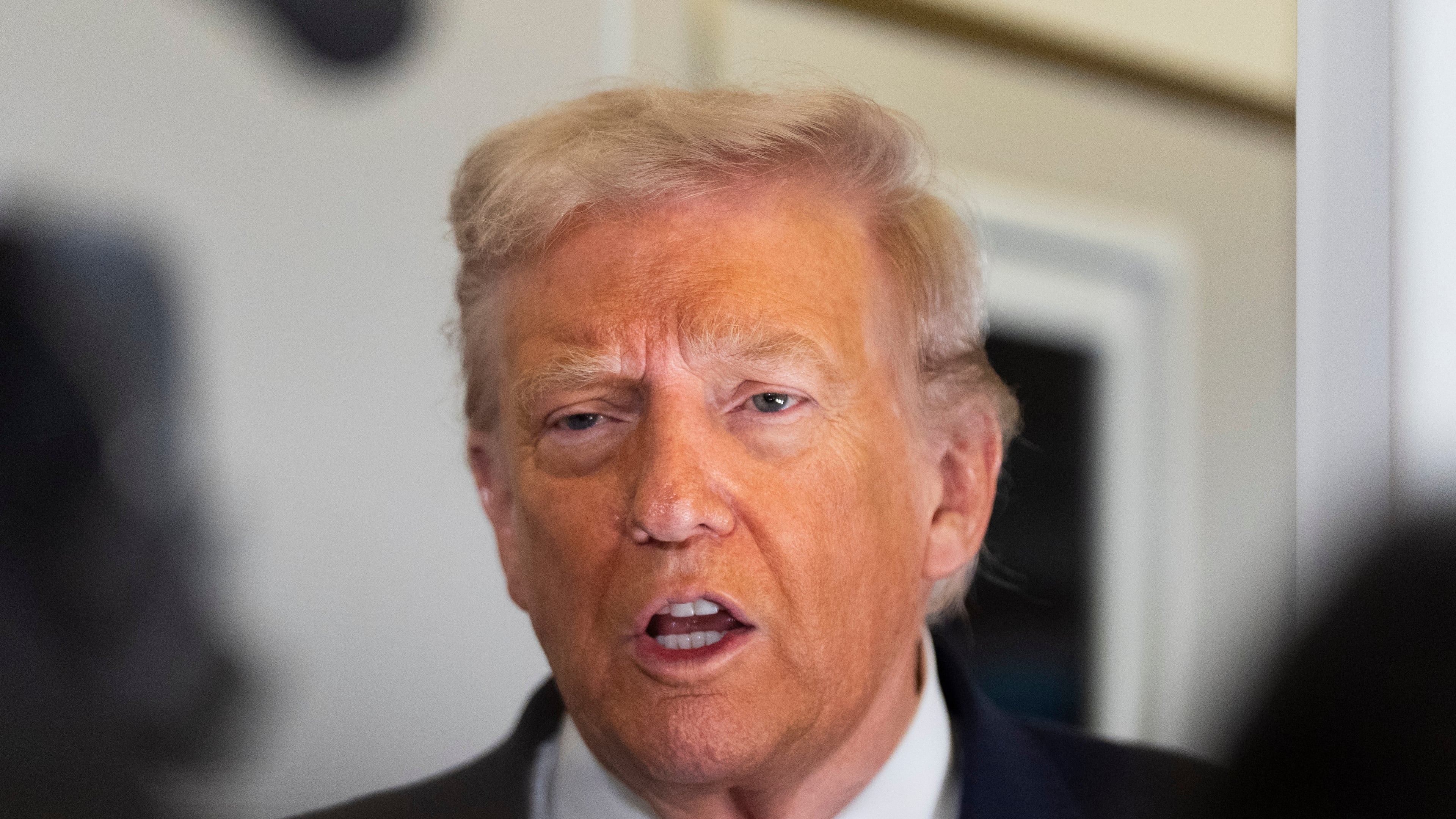 President Donald Trump speaks to the media after boarding Air Force One at Joint Base Andrews, Md., Friday, Oct. 31, 2025, enroute to Florida. AP Photo/Manuel Balce Ceneta)