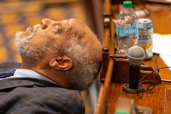 State Sen. David Lucas, D-Macon, rests his head during a debate in the state Senate last yaer. (Arvin Temkar/AJC)