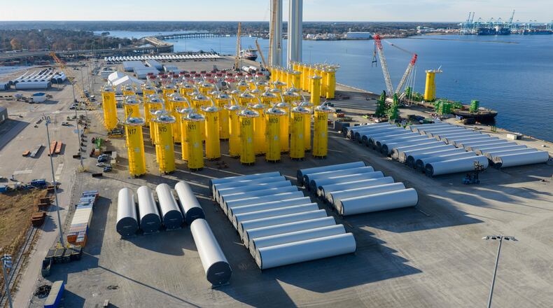 FILE - Wind turbine bases, generators and blades are positioned along with support ships at The Portsmouth Marine terminal at the staging area for Dominion Energy's wind turbine project Monday Dec. 22, 2025, in Portsmouth, Va. (AP Photo/Steve Helber, File)