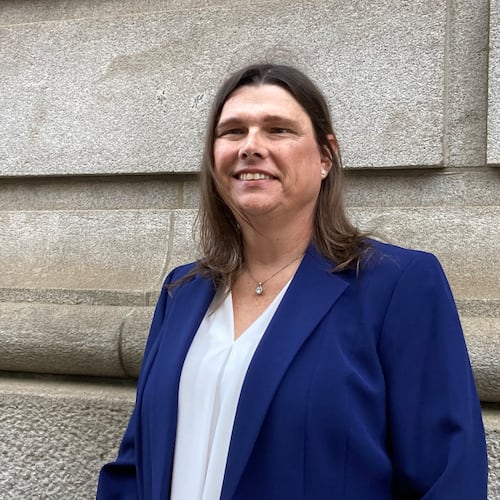 Sgt. Anna Lange, pictured outside the 11th Circuit courthouse in Atlanta in February 2025, has settled her landmark transgender rights case against Houston County and its sheriff. (Rosie Manins/AJC)