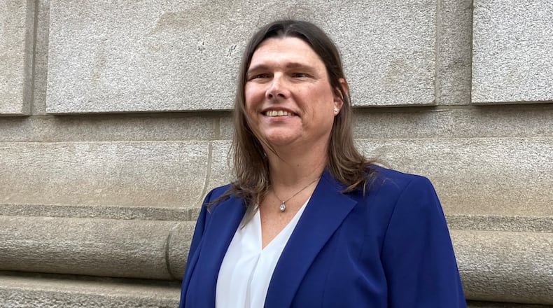 Sgt. Anna Lange, pictured outside the 11th Circuit courthouse in Atlanta in February 2025, has settled her landmark transgender rights case against Houston County and its sheriff. (Rosie Manins/AJC)
