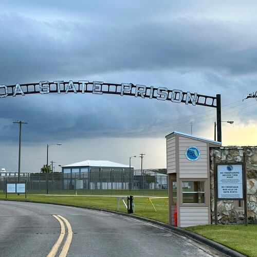 FILE - Clouds hover over the entrance of the Florida State Prison in Starke, Fla., Aug. 3, 2023. (AP Photo/Curt Anderson, File)
