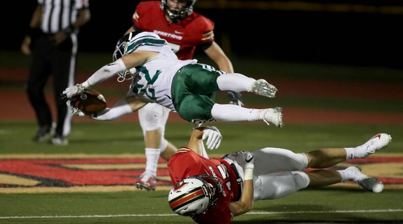 Westminster running back Will Hallmark (22) scores a touchdown against GAC defensive back Joseph Rose (15) in the second half at Greater Atlanta Christian Friday, August 24, 2018, in Norcross, Ga. Westminster won 22-21. PHOTO / JASON GETZ
