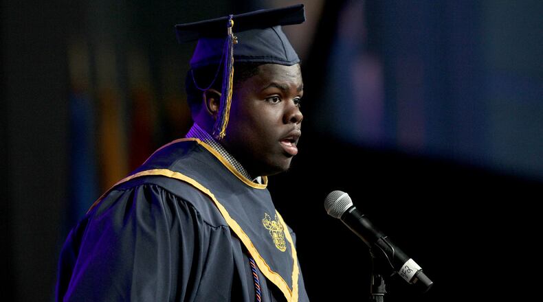 Walter Coggins Jr. speaks at his graduation from Atlanta's Best Academy at the Georgia Dome in May.