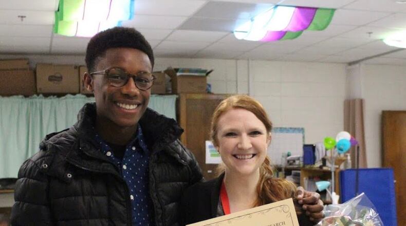 FIRST program president Derek Ewers of McIntosh High School presented a grant to North Fayette special education teacher Sarah Gauvin. Courtesy Fayette County Public Schools