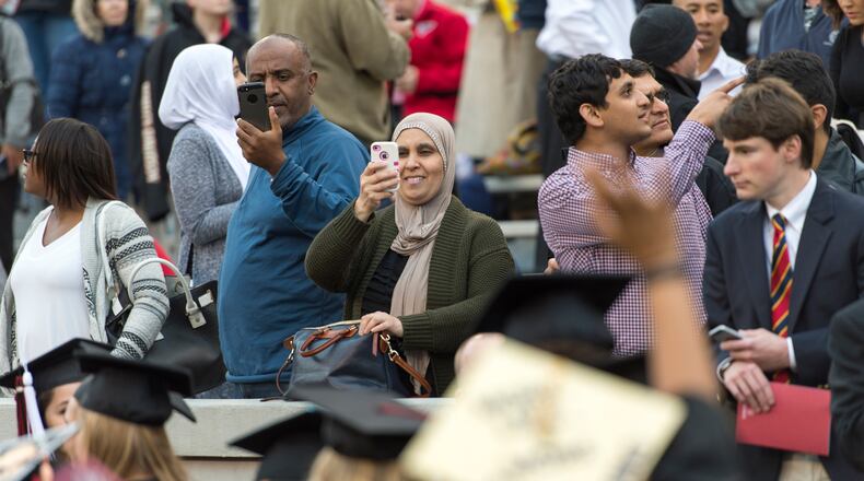 May 5, 2017, Athens - Parents watch the students walk onto the field during the University of Georgia's undergraduate commencement ceremony at Sanford Stadium in Athens, Georgia, on Friday, May 5, 2017. (DAVID BARNES / DAVID.BARNES@AJC.COM)