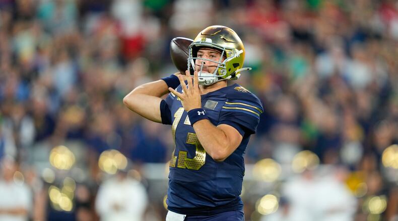 Notre Dame quarterback CJ Carr throws during the first half of an NCAA college football game against Wisconsin Sunday, Sept. 6, 2026, in Green Bay, Wis. (AP Photo/Kayla Wolf)