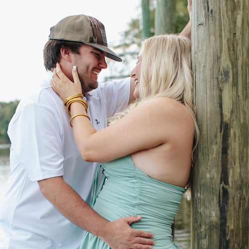 Hunter Bratcher (left) poses with his match during a "stranger sessions" photo shoot, an experience designed to spark connection between two people who have never met. (Courtesy of Lanie Mae Co. Photography)