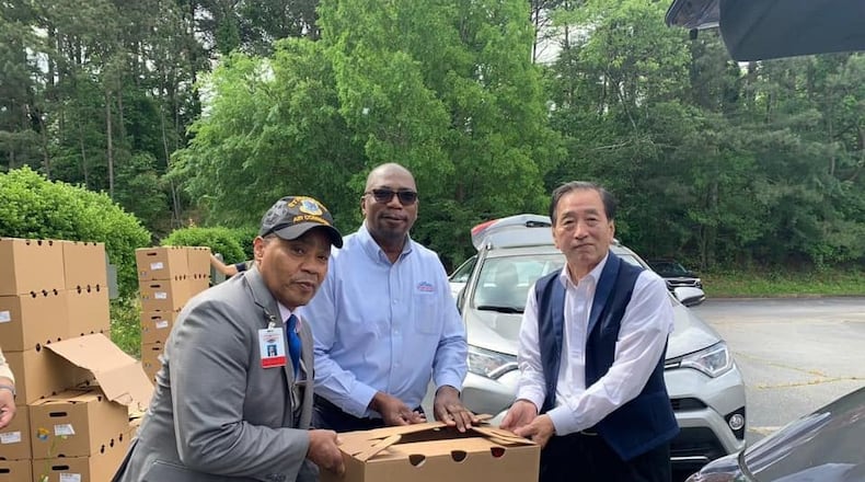 Norcross Mayor Craig Newton joined forces recently with the Korean American Association of Greater Atlanta, President Charlie Yoon Kim of Korea American Association and Solicitor General Brian Whiteside along with volunteers to distribute 2400 food boxes to those in need. (Courtesy City of Norcross)
