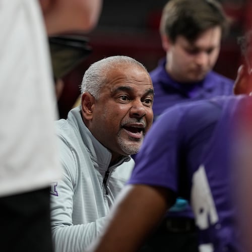 Kansas State head coach Jerome Tang talks to his players during a timeout during the first half of an NCAA college basketball game against Houston, Saturday, Feb. 14, 2026, in Houston. (AP Photo/ Karen Warren)