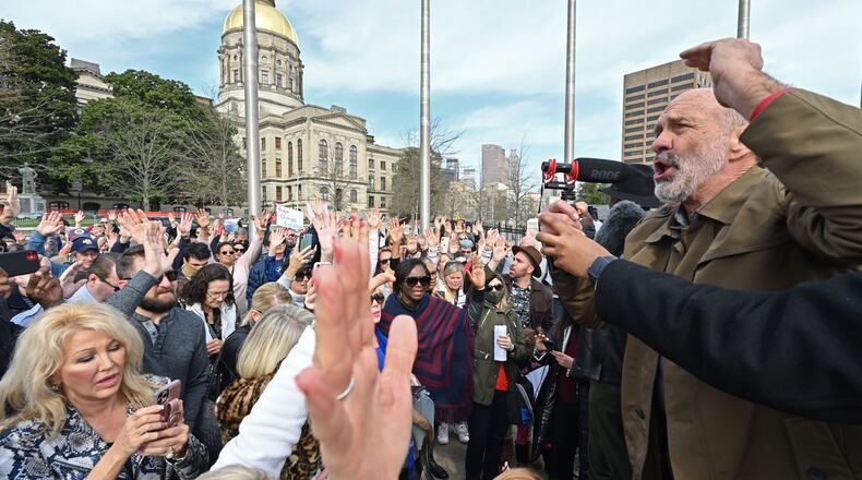 Lou Engle leads a prayer as participants gathered at Liberty Plaza to pray for Georgians to vote for candidates with distinctly biblical values during the Georgia Prayer March event in Atlanta on Saturday, January 2, 2021, outside the state Capitol. (Hyosub Shin / Hyosub.Shin@ajc.com)