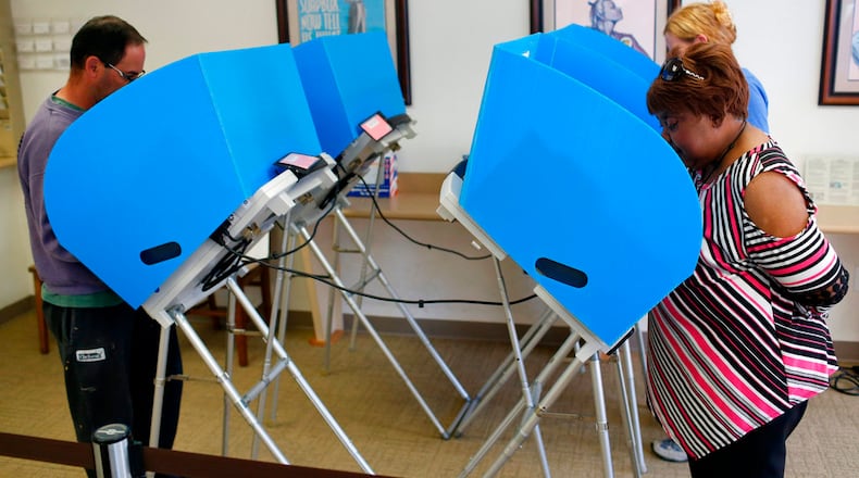 Locals cast their vote on the first day of early voting in the Athens-Clarke County elections in Athens, Ga., Monday, April 30, 2018. Voters across Georgia are now able to cast early ballots for the upcoming primary election that includes races for governor, the U.S. Congress, superintendent of schools and the state Legislature. (Joshua L. Jones/Athens Banner-Herald via AP)