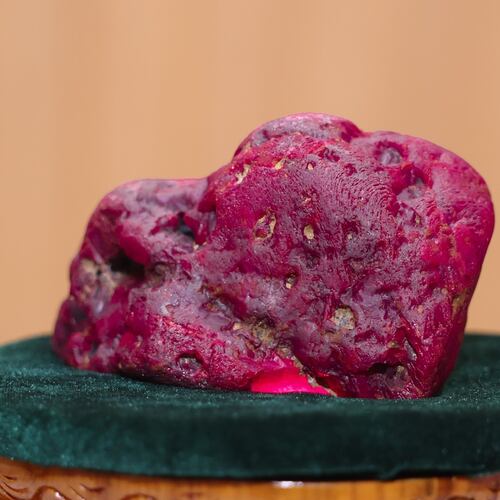 In this photo provided by Myanmar Military True News Information Team on Thursday, May 7, 2026, Myanmar's newly discovered ruby is displayed at president office in Naypyitaw, Myanmar. (Myanmar Military True News Information Team via AP Photo)