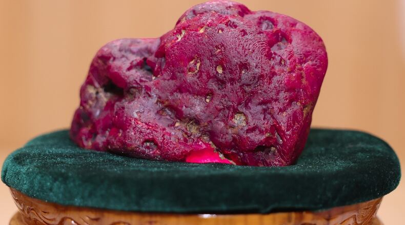 In this photo provided by Myanmar Military True News Information Team on Thursday, May 7, 2026, Myanmar's newly discovered ruby is displayed at president office in Naypyitaw, Myanmar. (Myanmar Military True News Information Team via AP Photo)