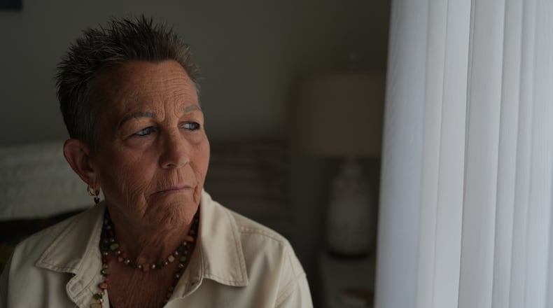 Deb Robertson, a leading advocate for a medical aid-in-dying law named after her in Illinois, pauses during an interview in her home in Lombard, Ill., on Tuesday, Sept. 8, 2026. (AP Photo/Luis Andres Henao)