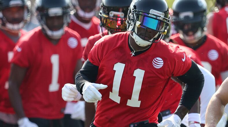 July 27, 2017 Flowery Branch: Falcons wide receiver Julio Jones runs a agility drill the first day of team practice at training camp on Thursday, July 27, 2017, in Flowery Branch. Curtis Compton/ccompton@ajc.com