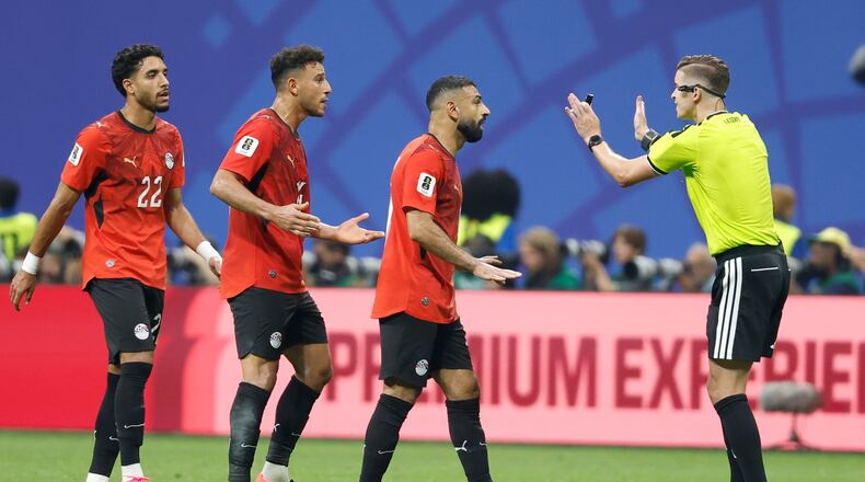 Egypt's Mohamed Salah (10) talks with Referee Francois Letexier, of France, during the World Cup round of 16 soccer match between Argentina and Egypt in Atlanta, Tuesday, July 7, 2026. (AP Photo/Erik S. Lesser)