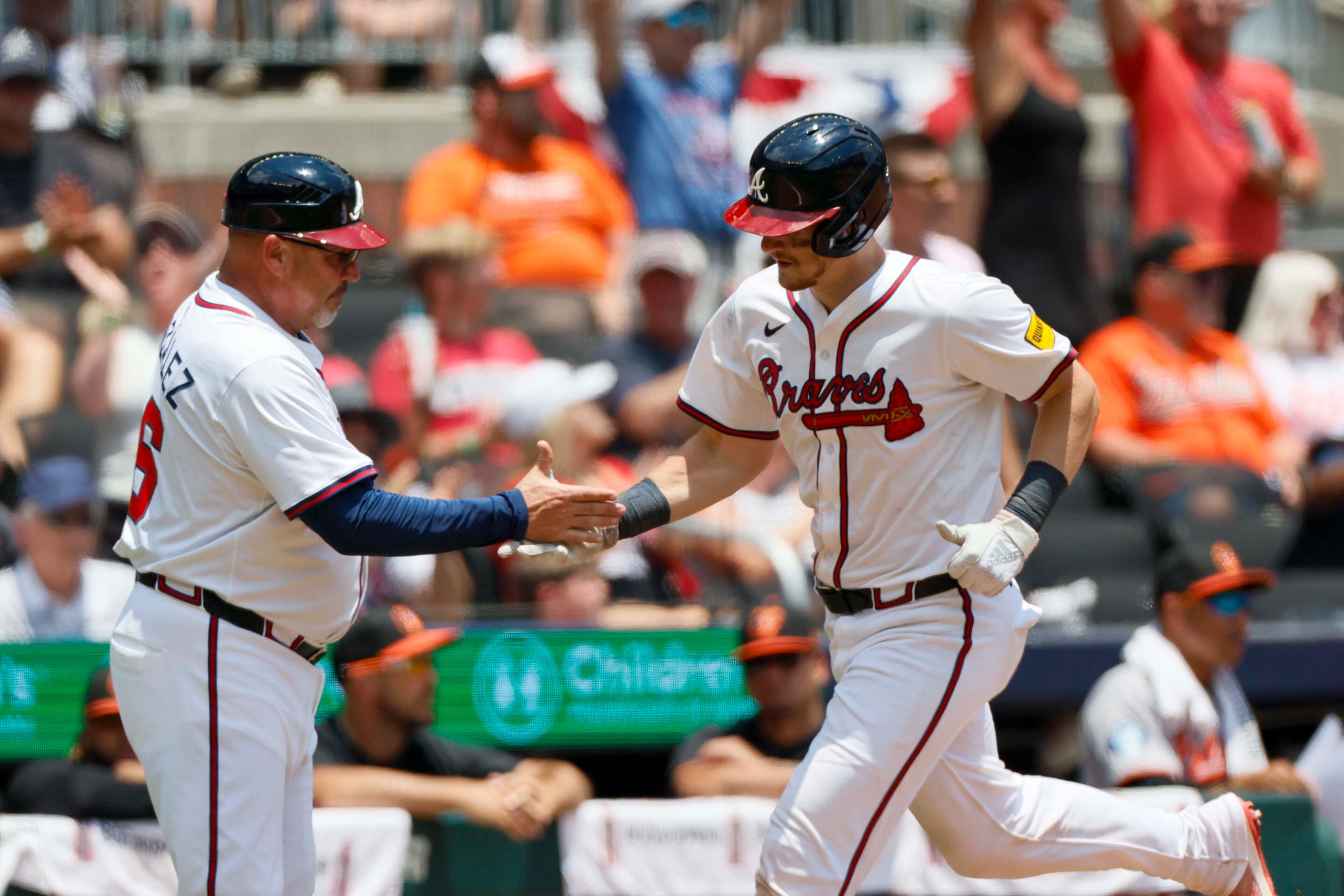 Atlanta Braves catcher Sean Murphy (12) shakes hans with Atlanta Braves third base coach Fredi González (86) after hiting a solo home run during the ninth inning against the Baltimore Orioles at Truist Park on Sunday, July 6, 2025, in Atlanta.
(Miguel Martinez/ AJC)