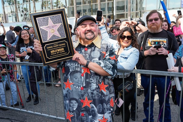 Gabriel "Fluffy" Iglesias poses with fans during a ceremony honoring him with a star on the Hollywood Walk of Fame on Tuesday, March 2, 2026, in Los Angeles. (Chris Pizzello/AP)
