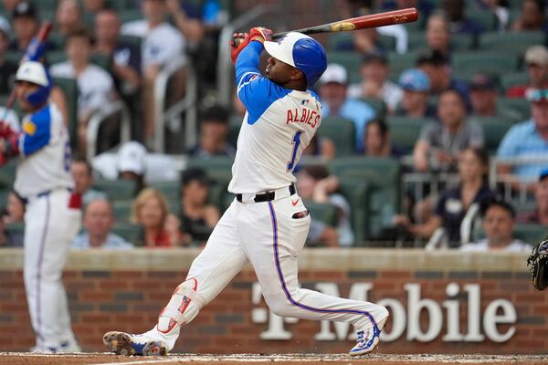 Atlanta Braves second baseman Ozzie Albies (1) hits a three-run home run against the New York Yankees in the fourth inning of a baseball game, Saturday, July 19, 2025, in Atlanta. (AP Photo/Mike Stewart)