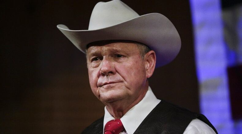 In this Sept. 25, 2017, file photo, former Alabama Chief Justice and U.S. Senate candidate Roy Moore speaks at a rally, in Fairhope, Ala. According to a Washington Post story Nov. 9, an Alabama woman said Moore made inappropriate advances and had sexual contact with her when she was 14. (AP Photo/Brynn Anderson, File)