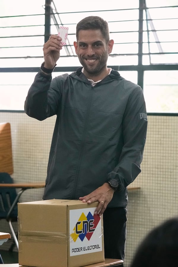 Juan Requesens, former opposition lawmaker and candidate for governor of Miranda state, votes in legislative and local elections in Caracas, Venezuela, Sunday, May 25, 2025. (AP Photo/Ariana Cubillos)