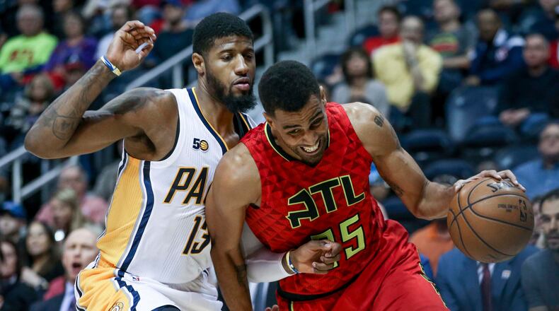 Atlanta Hawks forward Thabo Sefolosha (25) drives the ball past Indiana Pacers forward Paul George (13) during the first quarter of an NBA basketball game, Sunday, March 5, 2017, in Atlanta. (AP Photo/Branden Camp)