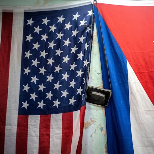 FILE - A U.S. and Cuban flag hangs on a wall in Havana, Cuba, Monday, Jan 11, 2021. (AP Photo/Ramon Espinosa, File)