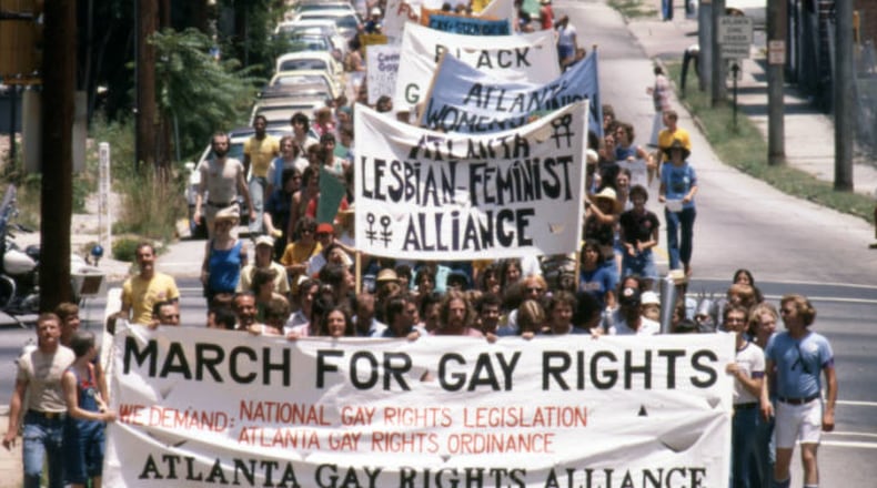 Atlanta Gay Rights Alliance and others leading the Pride parade through Atlanta, June 25, 1977. About 1,200 marchers began downtown and marched up to Piedmont Park. (Jerome McClendon / AJC Archive at GSU Library AJCN015-026a)