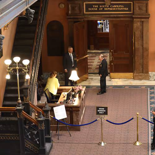 The South Carolina House chamber is roped off as authorities put in extra security during debate on a redistricting bill on Friday, May 15, 2026, in Columbia, S.C. (AP Photo/Jeffrey Collins).