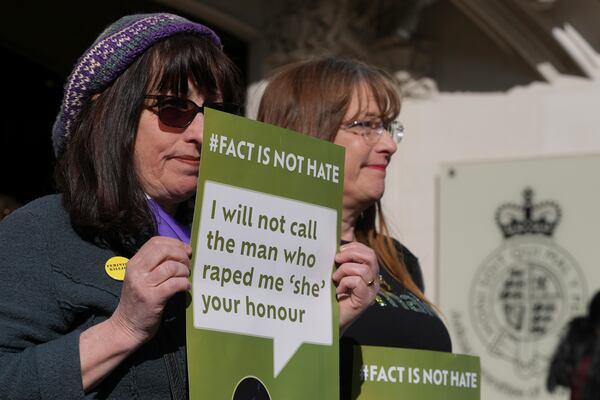 Women's rights activists hold placards outside the Supreme Court to challenge gender recognition laws, in London, Wednesday, April 16, 2025. (AP Photo/Kin Cheung)