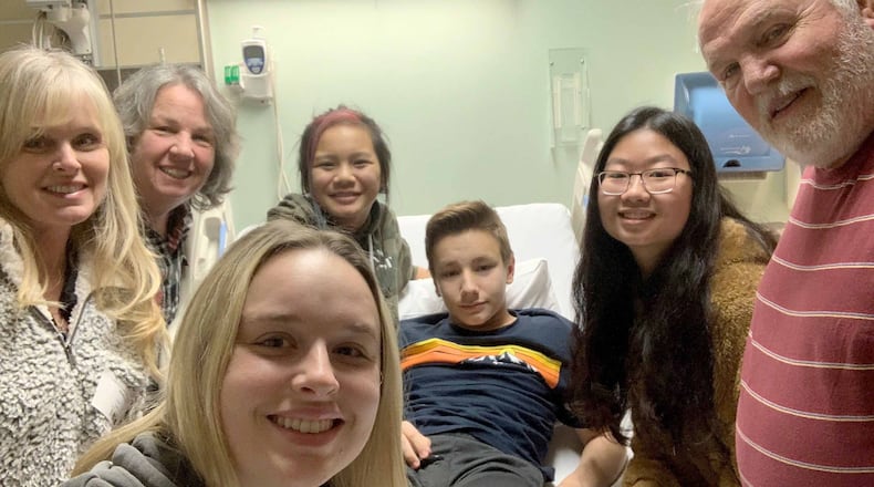 Kincaid Eaker, 13, was joined by his grandparents, sister and family friends before heading into surgery early Thursday. (Family photo)