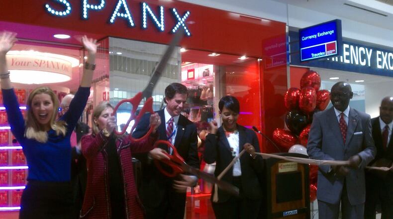 Spanx founder Sara Blakely, far left, celebrates the opening of the first airport Spanx store during a hosiery ribbon-cutting event at Hartsfield-Jackson International Airport in December 2012.
